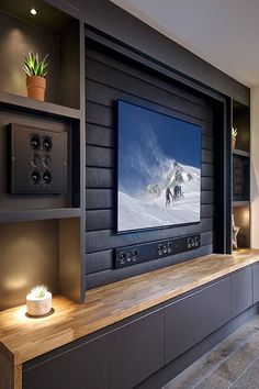 a flat screen tv mounted to the side of a wall