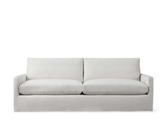 a white couch sitting on top of a wooden floor