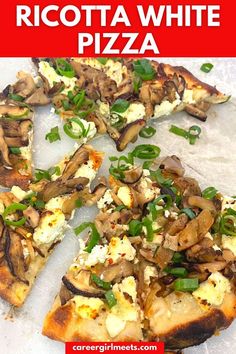 a pizza with mushrooms, cheese and green onions on it is cut into four pieces