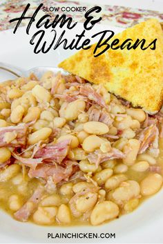 slow cooker ham and white beans recipe on a plate with a piece of bread