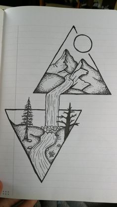 someone is holding up a drawing with mountains and trees in the middle, on top of a notebook