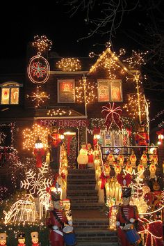 a house covered in christmas lights and decorations