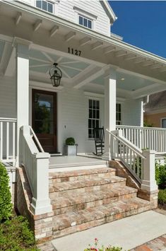 front porch with steps leading up to the house