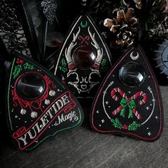 three christmas ornaments are sitting next to each other