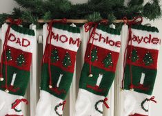 three christmas stockings hanging from a radiator with the words, mom's and dad's written on them