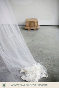 a pile of white powder sitting on top of a floor next to a wooden box