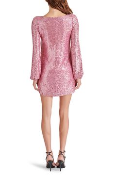 This party dress is covered in shimmering sequins that expertly catch the light of the dance floor and eyes of admirers. 34 3/4" length Slips on over head Jewel neck Long sleeves with elastic cuffs Lined 95% polyester, 5% spandex Spot clean Imported Sequin Dress For Club Evening, Glamorous Mini Sequin Dress For Costume Party, Mini Length Sequin Dress For Party Season, Sequin Dress For Costume Party During Party Season, Glamorous Sequin Club Dress For Spring, Fitted Mini Dress With Contrast Sequin For Festive Occasions, Sequin Mini Dress For Costume Party In Spring, Spring Embellished Sequin Dress Party-ready, Sequin Mini Dress For Spring Costume Party