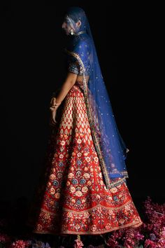 Red raw silk embroidered lehenga with attached cancan and sequin, cutdana, gold thread work. Comes with embroidered padded blue blouse and dupatta.
Components:3
Pattern:Embroidery
Type of Work:Cutdana,Sequin,Thread work
Neckline:Sweetheart
Sleeve Type:Half sleeves
Fabric:Raw Silk
Color:Red
Other Details:
Attached lining
Weight approx (in kg) : 10
Pocket on side
Note: The neckpiece worn by the model is not for sale
Occasion:Bride,Wedding - Aza Fashions Festive Raw Silk Lehenga With Meenakari Detail, Festive Raw Silk Lehenga With Meenakari, Red Kundan Lehenga With Dupatta, Festive Meenakari Raw Silk Lehenga, Bollywood Silk Lehenga With Meenakari Detail, Silk Lehenga With Dori Work For Traditional Ceremonies, Silk Lehenga With Meenakari For Reception, Embroidered Fabric With Meenakari For Reception, Traditional Drape, Embroidered Fabric With Meenakari For Reception