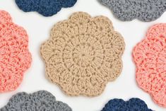 crocheted coasters are arranged on a white surface