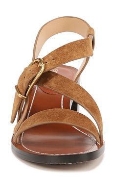 Crisscrossing straps and an adjustable buckle closure lend visual intrigue to a summer-ready sandal lifted by a stacked block heel. 3" heel Adjustable slingback strap with buckle closure Leather upper and lining/leather and rubber sole Imported Leather Double Strap Sandals With Stacked Heel, Leather Sandals With Stacked Heel And Double Strap, Leather Wedge Sandals With Block Heel And Adjustable Strap, Luxury Brown Sandals With Stacked Heel, Brown Cross Strap Sandals With Heel Strap, Brown Sandals With Heel And Cross Straps, Chic Brown Slingback Sandals With Adjustable Strap, Luxury Slingback Sandals With Adjustable Strap, Leather Cross Strap Sandals With Stacked Heel