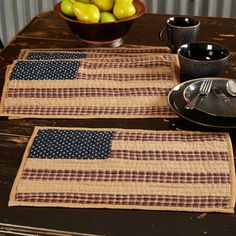 two placemats with an american flag design on them next to a bowl of lemons