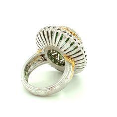 This exquisite halo cocktail ring features a stunning, 13.52 carat mint-green tourmaline oval set in an intricately handcrafted, 18k yellow and white gold original design. Handmade in Italy, this ring is the perfect showcase for such an impressive gem. The finely engraved 18k yellow gold bezel highlights the spectacular brilliance of the faceted tourmaline, and the second halo of individually set round white diamonds set in 18k white gold underscores the bright, open color of the gem and its exc Luxury Oval Green Dome Ring, Green Multi-stone Gemstones In Fine Jewelry Style, Green Multi-stone Fine Jewelry Gemstones, Fine Jewelry Yellow Multi-stone Rings, Fine Jewelry Lime Green Gemstone Ring, Luxury Lime Green Gemstone Ring, Yellow Gold Cocktail Ring, Gold Cocktail, Gold Cocktail Ring