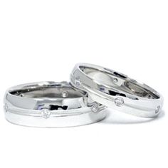 two white gold wedding rings with diamonds