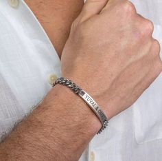 "Get your man something personal and stylish for a special occasion. The simple and beautiful bracelet made of stainless steel band  set with a stainless steel palette which you can engrave on it names, dates, initials, roman numerals, coordinates, message and signs. Bracelet comes with 2\" (5cm) extension chain.  These make the perfect gift. Every purchase comes packaged in a sweet box. It carefully protects items during the shipping and is perfect for gift giving or keeping for yourself.  Plea Customizable Silver Bracelet, Silver Bar Bracelet, Man Bars, Handmade Leather Bracelets, Mens Bracelet Silver, Bar Bracelet, Beads Bracelet Design, Hand Bracelet, Silver Bar