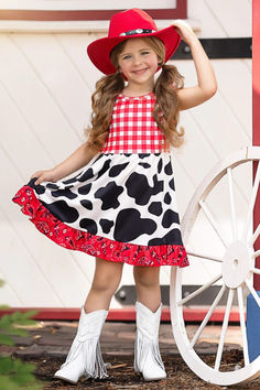 We're bringing fabulous fashion to the rodeo with our cow print ruffle dress. Dressed up with a mix of fun patterns and playful ruffles, this showstopper makes a sassy statement. Your little cowgirl will turn into a rodeo star! Playful Ruffled Dresses For Fall, Fun Summer Dress With Ruffle Hem, Playful Fitted Dress For Fall, Playful Fitted Dress With Ruffle Hem, Fun Fitted Ruffle Dresses, Rodeo Cowgirl, Fun Patterns, Night Light Kids, Fabulous Fashion