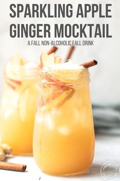 two mason jars filled with sparkling apple ginger mochal and cinnamon stick garnish