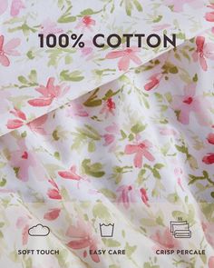 the back side of a pink and green floral print fabric with 100 % cotton on it