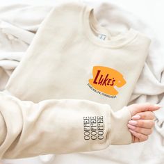 Our sweatshirts are super soft and are made with 50% cotton 50% polyester. Color customizable. Sizing is unisex. Lukes Coffee Shirt, Luke’s Diner Sweatshirt, Fall Sweatshirt Vinyl, Gilmore Girls Clothes, Gilmore Girls Merch, Gilmore Girls Hoodie, Cricut Sweatshirt Ideas, Sweatshirt And Shirt Outfit, Gilmore Girls Tattoo