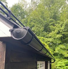 the gutter is attached to the roof of this house