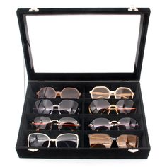 six pairs of sunglasses in a black case