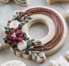 cookies decorated with flowers and leaves on a table