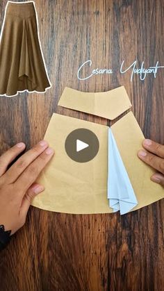 someone is making a skirt out of paper