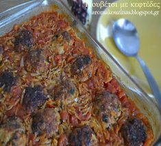 a casserole dish with meatballs and tomato sauce