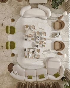 an aerial view of a living room with white furniture