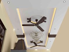 a ceiling fan mounted to the ceiling in a room with white walls and flooring