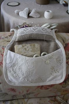 a white purse sitting on top of a table