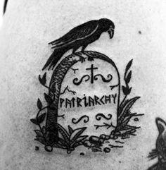 a black and white photo of a tattoo with a bird on it