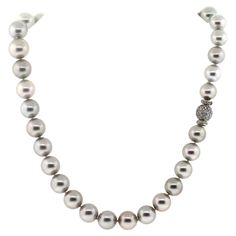 Hakimoto By Jewel Of Ocean 18K Tahitian South Sea Strand Necklace 18K White Gold 1.75 Carts Diamonds Clasp Weight (g): 75.6 Cultured Tahitian South Sea Pearl Pearl Size: 12.75X10.5mm Pearl Shape: Round Body color: Light Silver Orient: Very Good Luster: Very Good Surface: Clean Nacre: Very Good Matching: Very Good Maker: Jewel Of Ocean Estimated Manufactures Retail Price: $ 32,000 Excellent Condition Chain Length 17" Designer: Hakimoto All gemstone weights and measurements are approximate. Item # NTS-110 South Sea Pearl Necklace, Sea Pearl, South Seas, South Sea Pearls, Body Color, Body Colour, Pearl Size, Strand Necklace, Chain Lengths