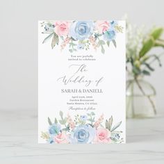 a wedding card with blue and pink flowers