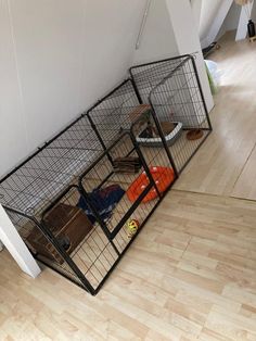 an animal cage in the corner of a room