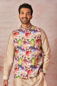 Peach bundi with all over multi color floral print, hand embossed French knots and dabka pitta embroidery. Paired with full sleeve kurta and pant style pyjama. - Aza Fashions Festive Multicolor Nehru Jacket With Printed Motifs, Spring Designer Nehru Jacket With Printed Motifs, Spring Nehru Jacket With Printed Motifs For Designer Wear, Spring Nehru Jacket With Printed Motifs, Multicolor Nehru Jacket With Printed Motifs For Festivals, Traditional Multicolor Nehru Jacket With Printed Motifs, Multicolor Sleeveless Kurta For Festive Occasions, Festive Multicolor Nehru Jacket For Designer Wear, Festive Multicolor Sleeveless Kurta