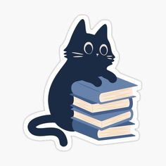 a black cat sitting on top of a stack of books