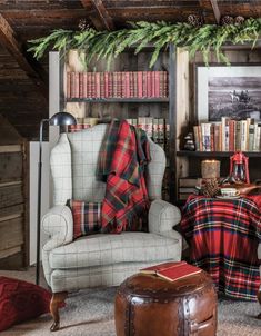 a living room filled with furniture and bookshelves covered in christmas blankets on top of them