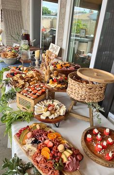 an assortment of food is displayed on a table at a wedding or bridal party