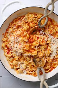 a skillet filled with pasta and sauce