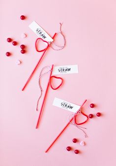 valentine's day candy wands on pink background