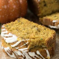 a loaf of cake sitting on top of a cutting board next to other food items