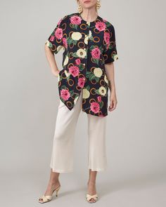 Introducing a stunning vintage 100% silk shirt for women in size S. This short-sleeve summer blouse features a vibrant floral print, perfect for adding a splash of color to your everyday wear or garden party outfits.  Made from pure, high-quality silk, this blouse is exceptionally lightweight and airy, ensuring you stay comfortable and stylish.  It features a relaxed fit, hip length cut with side slits and lovely golden metallic buttons. Looking for a thoughtful, sustainable gift for a friend wh Garden Party Outfits, Garden Party Outfit, Handmade Pants, Summer Blouse, Blouse For Women, Summer Blouses, Beautiful Blouses, Womens Blouses, Fine Fabric