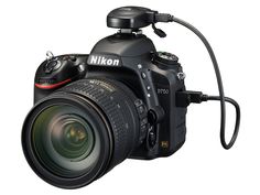 the nikon d700 camera is shown with its flash light attached to it