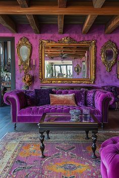 a living room filled with purple couches and mirrors