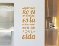 a kitchen wall with spanish words on it