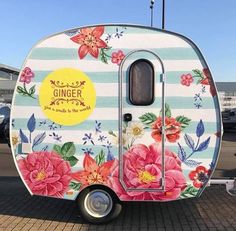 the trailer is decorated with flowers and stripes