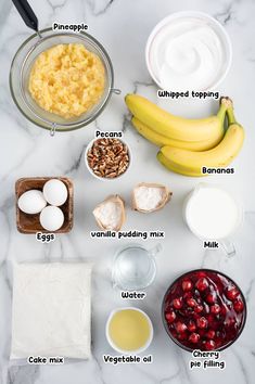 ingredients to make cranberry oatmeal recipe displayed on marble counter top