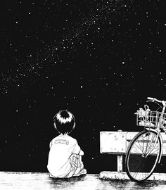 a boy sitting on a bench looking at the stars in the sky with a bike parked next to him