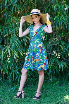 Drinking cocktails in your backyard or strolling the botanical gardens, our Jungle Parrot collection will give you all the vacation vibes! This colorful recreation of a 1940s tropical novelty print is in silky smooth flat rayon and fashioned into our most popular summer styles. The Sandra Dress is take on our popular Sandy Dress updated with a center back zipper and knee length skirt. Crossover v-neck front Center Back Zipper 1940s style gathered cap sleeve Fitted waistband Invisible back zipper Trashy Diva, Tropical Print Dress, Vacation Vibes, Black Satin Dress, Clothing And Textile, Antique Clothing, Fashion Design Sketches, Summer Styles, 1940s Fashion