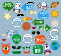 an assortment of outer space themed birthday party photo booth props